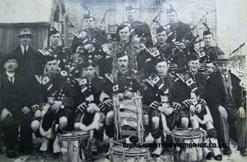 Pipe Major Duncan Macfarlane after the war, in 1923. He is central to the photograph behind the large drum.